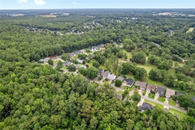 Between the rolling greens of Turkey Creek and the lush forest on Turkey Creek Golf and Country Club in Florida - for sale on GolfHomes.com, golf home, golf lot