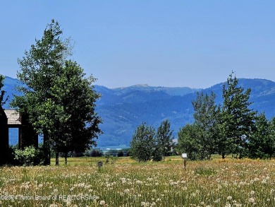 Stunning custom home site overlooking Hole 7 of the Hale Irwin on Teton Reserve in Idaho - for sale on GolfHomes.com, golf home, golf lot