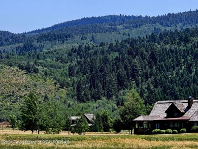 Stunning custom home site overlooking Hole 7 of the Hale Irwin on Teton Reserve in Idaho - for sale on GolfHomes.com, golf home, golf lot