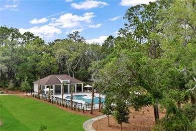 Begin your day sipping coffee as the sun rises, casting a warm on Jekyll Island Golf Club in Georgia - for sale on GolfHomes.com, golf home, golf lot