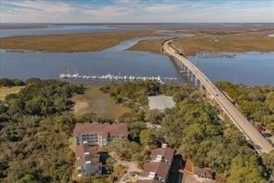 Begin your day sipping coffee as the sun rises, casting a warm on Jekyll Island Golf Club in Georgia - for sale on GolfHomes.com, golf home, golf lot