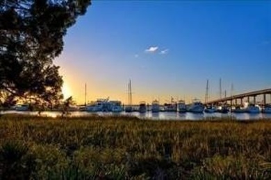 Begin your day sipping coffee as the sun rises, casting a warm on Jekyll Island Golf Club in Georgia - for sale on GolfHomes.com, golf home, golf lot