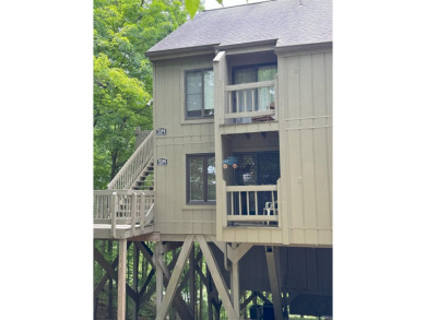 Your personal tree house! Seasonal view of a Lake Monroe inlet on The Eagle Pointe Golf Resort in Indiana - for sale on GolfHomes.com, golf home, golf lot