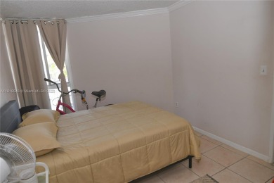 Charming 2-Bedroom Condo in Desirable Las Brisas at Country Club on Country Club of Miami in Florida - for sale on GolfHomes.com, golf home, golf lot