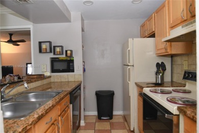 Charming 2-Bedroom Condo in Desirable Las Brisas at Country Club on Country Club of Miami in Florida - for sale on GolfHomes.com, golf home, golf lot