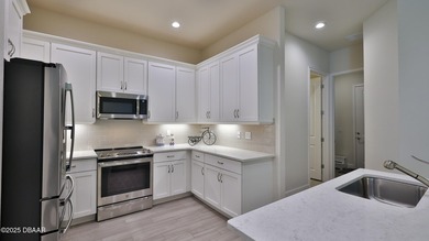 Don't miss this beautifully designed 3-bedroom, 3-bath townhome on Plantation Bay Golf and Country Club in Florida - for sale on GolfHomes.com, golf home, golf lot