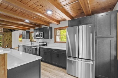 Situated on the golf course in Tanglwood Lakes, this stunning on Paupack Hills Golf and Country Club in Pennsylvania - for sale on GolfHomes.com, golf home, golf lot