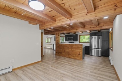 Situated on the golf course in Tanglwood Lakes, this stunning on Paupack Hills Golf and Country Club in Pennsylvania - for sale on GolfHomes.com, golf home, golf lot