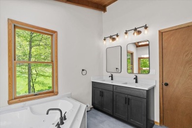 Situated on the golf course in Tanglwood Lakes, this stunning on Paupack Hills Golf and Country Club in Pennsylvania - for sale on GolfHomes.com, golf home, golf lot