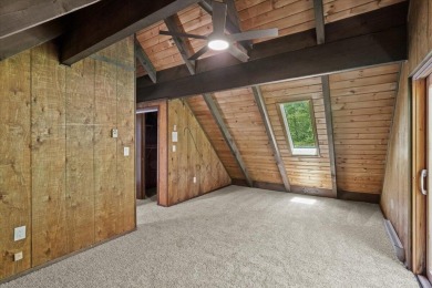 Situated on the golf course in Tanglwood Lakes, this stunning on Paupack Hills Golf and Country Club in Pennsylvania - for sale on GolfHomes.com, golf home, golf lot
