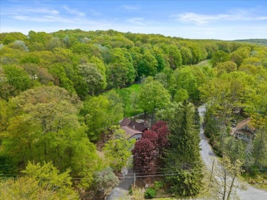 Situated on the golf course in Tanglwood Lakes, this stunning on Paupack Hills Golf and Country Club in Pennsylvania - for sale on GolfHomes.com, golf home, golf lot