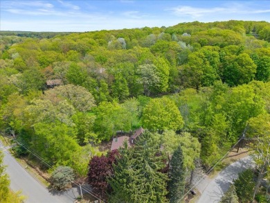Situated on the golf course in Tanglwood Lakes, this stunning on Paupack Hills Golf and Country Club in Pennsylvania - for sale on GolfHomes.com, golf home, golf lot