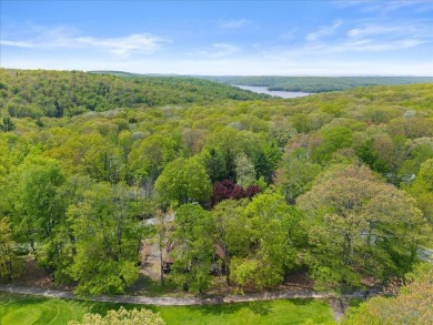 Situated on the golf course in Tanglwood Lakes, this stunning on Paupack Hills Golf and Country Club in Pennsylvania - for sale on GolfHomes.com, golf home, golf lot