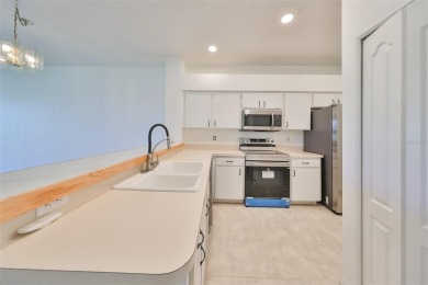 One or more photo(s) has been virtually staged. PEACEFUL AND on Falcon Watch Golf Club in Florida - for sale on GolfHomes.com, golf home, golf lot