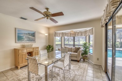 Discover sweeping golf course and lake views at this serene on Old Marsh Golf Club in Florida - for sale on GolfHomes.com, golf home, golf lot