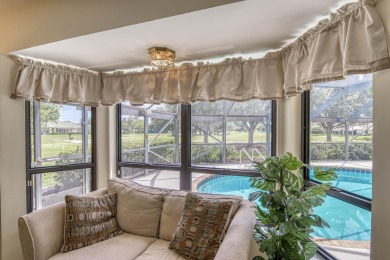 Discover sweeping golf course and lake views at this serene on Old Marsh Golf Club in Florida - for sale on GolfHomes.com, golf home, golf lot