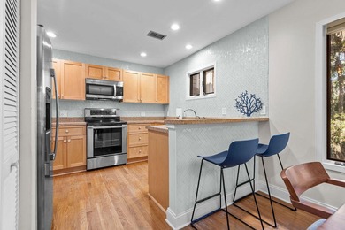 Enjoy relaxed coastal living in this 2 BR 2 BA upper-level end on The Seabrook Island Club in South Carolina - for sale on GolfHomes.com, golf home, golf lot