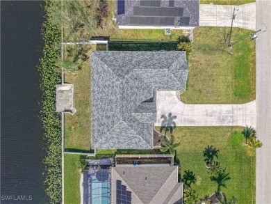 Welcome to this stunning waterfront residence in Cape Coral on Palmetto-Pine Country Club in Florida - for sale on GolfHomes.com, golf home, golf lot