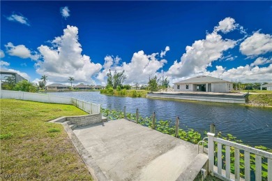 Welcome to this stunning waterfront residence in Cape Coral on Palmetto-Pine Country Club in Florida - for sale on GolfHomes.com, golf home, golf lot