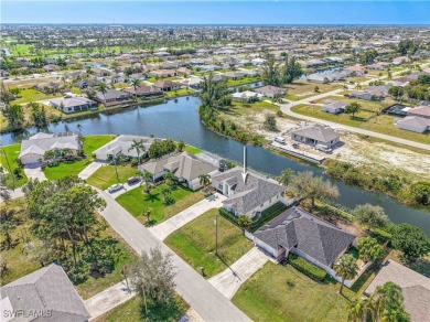 Welcome to this stunning waterfront residence in Cape Coral on Palmetto-Pine Country Club in Florida - for sale on GolfHomes.com, golf home, golf lot