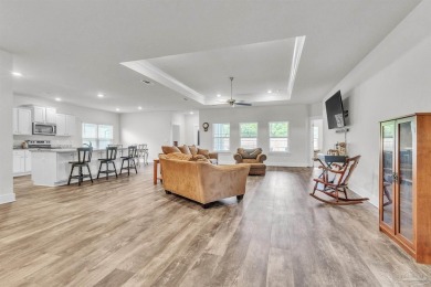 This beautifully designed 4-bedroom, 3-bathroom home with a on Tiger Point Golf and Country Club in Florida - for sale on GolfHomes.com, golf home, golf lot