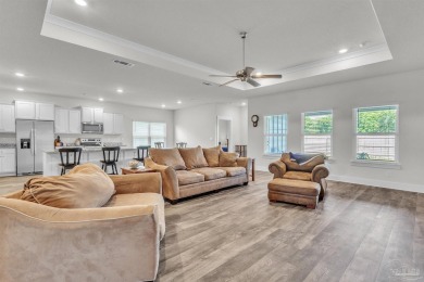 This beautifully designed 4-bedroom, 3-bathroom home with a on Tiger Point Golf and Country Club in Florida - for sale on GolfHomes.com, golf home, golf lot