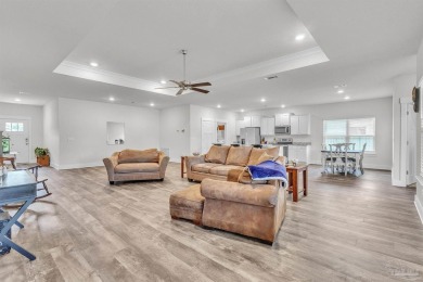 This beautifully designed 4-bedroom, 3-bathroom home with a on Tiger Point Golf and Country Club in Florida - for sale on GolfHomes.com, golf home, golf lot