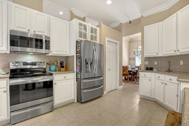 Discover this spacious 4-bedroom, 3-bath pool home located in on PGA National Estates Golf Course in Florida - for sale on GolfHomes.com, golf home, golf lot