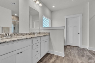 This beautifully designed 4-bedroom, 3-bathroom home with a on Tiger Point Golf and Country Club in Florida - for sale on GolfHomes.com, golf home, golf lot