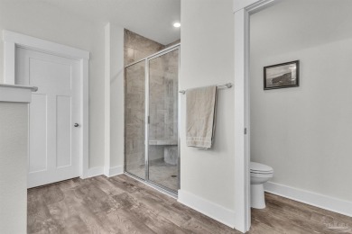 This beautifully designed 4-bedroom, 3-bathroom home with a on Tiger Point Golf and Country Club in Florida - for sale on GolfHomes.com, golf home, golf lot