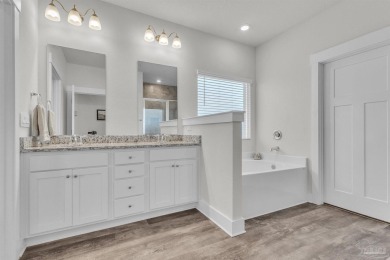 This beautifully designed 4-bedroom, 3-bathroom home with a on Tiger Point Golf and Country Club in Florida - for sale on GolfHomes.com, golf home, golf lot