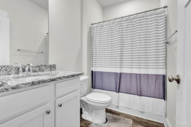 This beautifully designed 4-bedroom, 3-bathroom home with a on Tiger Point Golf and Country Club in Florida - for sale on GolfHomes.com, golf home, golf lot
