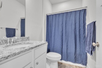 This beautifully designed 4-bedroom, 3-bathroom home with a on Tiger Point Golf and Country Club in Florida - for sale on GolfHomes.com, golf home, golf lot