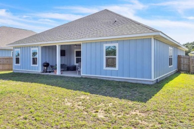 This beautifully designed 4-bedroom, 3-bathroom home with a on Tiger Point Golf and Country Club in Florida - for sale on GolfHomes.com, golf home, golf lot