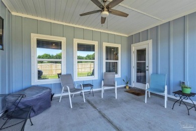 This beautifully designed 4-bedroom, 3-bathroom home with a on Tiger Point Golf and Country Club in Florida - for sale on GolfHomes.com, golf home, golf lot