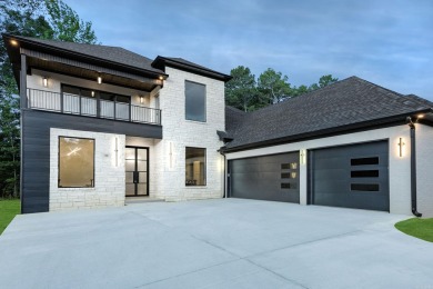 This contemporary home is brimming with amenities, featuring on Chenal Country Club - Bear Den Mountain in Arkansas - for sale on GolfHomes.com, golf home, golf lot