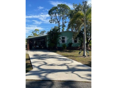 Stunningly immaculate home on the fifteenth tee of the Lake on Pine Lakes Country Club in Florida - for sale on GolfHomes.com, golf home, golf lot