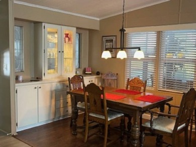 Stunningly immaculate home on the fifteenth tee of the Lake on Pine Lakes Country Club in Florida - for sale on GolfHomes.com, golf home, golf lot