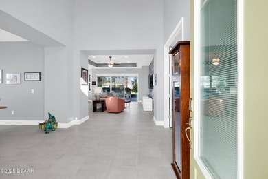 Live the laid-back dream in this vibrant Parrot model home! on LPGA International Golf Course in Florida - for sale on GolfHomes.com, golf home, golf lot