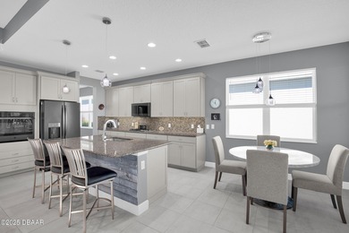 Live the laid-back dream in this vibrant Parrot model home! on LPGA International Golf Course in Florida - for sale on GolfHomes.com, golf home, golf lot