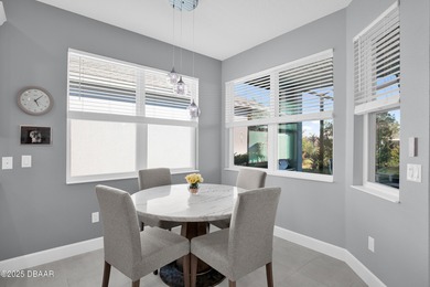 Live the laid-back dream in this vibrant Parrot model home! on LPGA International Golf Course in Florida - for sale on GolfHomes.com, golf home, golf lot