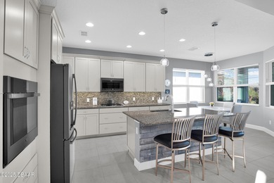 Live the laid-back dream in this vibrant Parrot model home! on LPGA International Golf Course in Florida - for sale on GolfHomes.com, golf home, golf lot