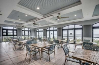 Experience coastal living in this stunning 5 bedroom 3.5 bath on Barefoot Resort and Golf Club  in South Carolina - for sale on GolfHomes.com, golf home, golf lot