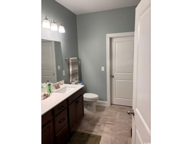 Experience coastal living in this stunning 5 bedroom 3.5 bath on Barefoot Resort and Golf Club  in South Carolina - for sale on GolfHomes.com, golf home, golf lot