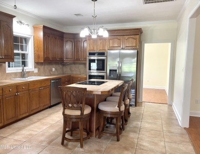 Beautiful 3-bedroom, 2-bath home situated on 1 acre overlooking on Pine Creek Golf Club in Mississippi - for sale on GolfHomes.com, golf home, golf lot