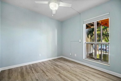 Enjoy breathtaking panoramic lake views from this charming on PGA National Golf Club in Florida - for sale on GolfHomes.com, golf home, golf lot