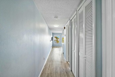 Enjoy breathtaking panoramic lake views from this charming on PGA National Golf Club in Florida - for sale on GolfHomes.com, golf home, golf lot