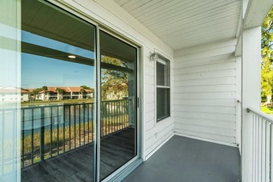 Enjoy breathtaking panoramic lake views from this charming on PGA National Golf Club in Florida - for sale on GolfHomes.com, golf home, golf lot