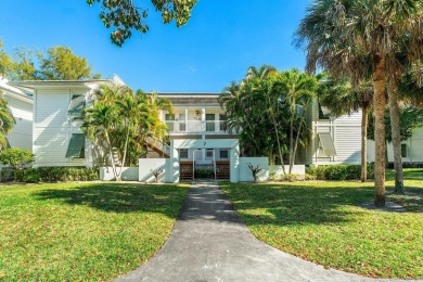 Enjoy breathtaking panoramic lake views from this charming on PGA National Golf Club in Florida - for sale on GolfHomes.com, golf home, golf lot