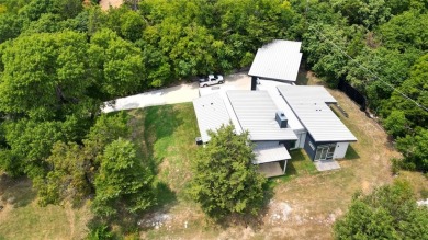 Stunning modern retreat atop a heavily treed .47-acre lot on Keeton Park Golf Course in Texas - for sale on GolfHomes.com, golf home, golf lot